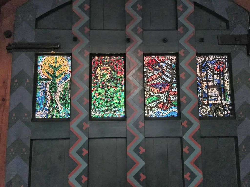 The stained glass panels in the door were added later