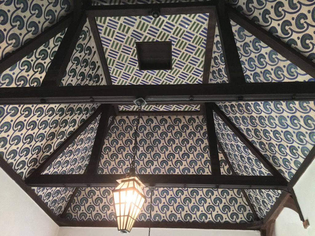 Ceiling above the stairs painted by hand